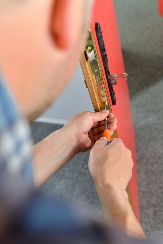 Handyman Repairing a Door